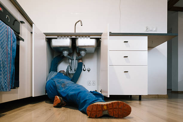 Professional Emergency Plumber technician working in Cambridge, WI